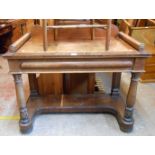 A 1.13m 19th Century mahogany and cross-banded washstand with shaped raised back, flanking batons
