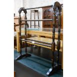 A reproduction stained wood Victorian style double towel rail