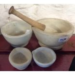 A pestle and Wedgwood mortar - sold with three further smaller mortars