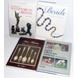 Four hardback antique reference books including The History of Beads, English Porcelain Animals