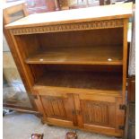 A 78cm Old Charm polished oak two shelf open bookcase with pair of panelled linen fold cupboard