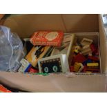 A box containing assorted toys including vintage Lego bricks, old marbles, five vintage card