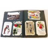A postcard album containing a collection of early 20th Century and later postcards including