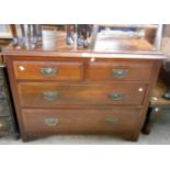 A 1.05m Edwardian walnut chest of two short and and two long graduated drawers, set on bracket