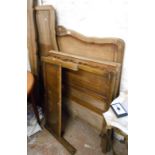 A 1.32m French oak double bedstead with carved shell pattern decoration and shaped rails - sold with