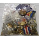 A bag of military badges and buttons including Devonshire Regiment, East Surrey Regiment and