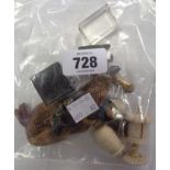 A bag containing a quantity of collectable items including carved bone tape measure, a miniature