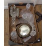 A box containing various items including meat spike, herb chopper, decanters, small convex mirror,