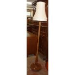 A 20th Century stained wood standard lamp and shade with reeded pillar and circular foot - for re-