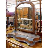 A Victorian platform dressing table mirror with arched plate and serpentine base - for re-polishing