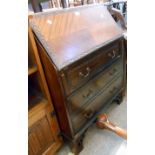 A 76 cm 20th Century mahogany and stained wood bureau with part fitted interior, blind fretwork