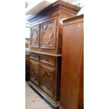 A 1.65m 19th Century French oak two part cabinet with dentil cornice and pair of panelled cupboard