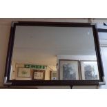 A 99cm campaign style modern stained wood framed oblong wall mirror with metal corners