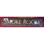 A vintage brass sign with enameled lettering Smoke Room