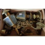 A box containing carriage style wall lamps, piano sconces, etc.