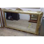 A 125cm giltwood framed oblong wall mirror with pierced pediment and later finish