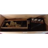 A box containing assorted artists items including acrylic tubes, paint boxes, brass lettering