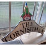 A modern cast metal Cornishman sign