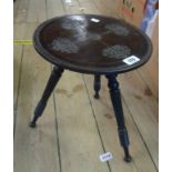 A 30cm diameter Anglo Indian stained hardwood low stool with carved and incised decoration, set on