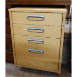 A 44cm modern blonde wood effect graduated four drawer filing cabinet, set on casters