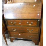 A 75cm early 20th Century mahogany bureau with part fitted interior and three long graduated drawers