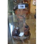 A vintage novelty carved wooden pipe rack in the form of a man wearing a beret - sold with a horse's