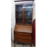 An 80cm early 20th Century bureau/bookcase with pair of beaded glazed panel doors to top, part
