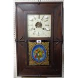 A 19th Century stained oak cased Seth Thomas American wall clock with decorative glazed panel door -
