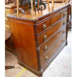 A 1.32m Regency mahogany chest with three short drawers, flanking acanthus reeded half columns and