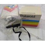 A Polaroid 1000 land camera with instructions and boxed Polartronic flash