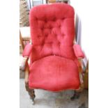 A Victorian mahogany part show frame drawing room armchair with red button back upholstery, set on