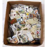 A box containing a large collection of loose cigarette and tea cards - various series, brands and