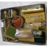 A small box of vintage medicine bottles and tins