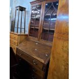 A 99cm 19th Century mahogany bureau/bookcase the later glazed top with Gothic beaded doors over a