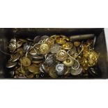 A tin of military and livery buttons