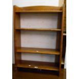 A 61.5cm stained mixed wood four shelf open bookcase