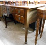 A 1.14m 20th Century oak knee-hole desk with central frieze drawer and four flanking short