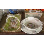 A 19th Century bone china basket decorated with central floral spray and apple green and gilt border