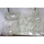 A large quantity of cut and moulded glassware including bowls, comports, rinsing glasses, etc.