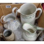 A box of four ceramic jugs
