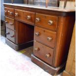 A 1.30m Victorian mahogany knee-hole dressing table with three frieze drawers and four flanking
