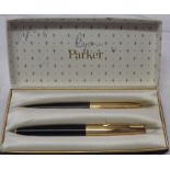 A boxed Parker 61 fountain and rollerball pen set with rolled gold lid and mounts - box defaced