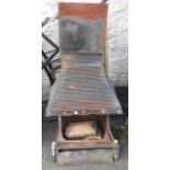 A 56cm Rayburn cast iron open fireplace with integral ribbed hood