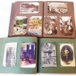 Early 20th Century red and green postcard albums containing a collection of corner mounted early