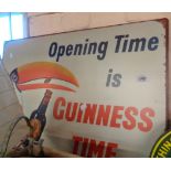 A large reproduction printed tin Guinness sign