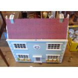 A vintage painted wood doll's house