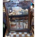 A 20th Century carved oak framed swing dressing table mirror with oblong plate and turned supports