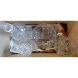 Four pieces of cut glassware comprising two decanters, bowl and vase