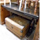 A 1.22m 20th Century stained oak draw-leaf refectory dining table with decorative carved apron,