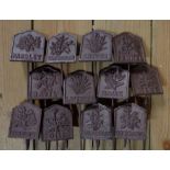 A set of twelve cast metal herb labels